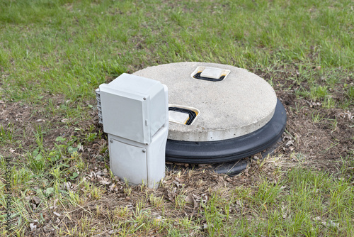 Septic tank alarm system. Septic tank with concrete lid