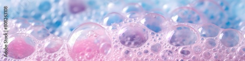 Background with macro bubble texture. Cleaning and laundry service concept. Abstract gradient pink and blue soap foam texture. photo