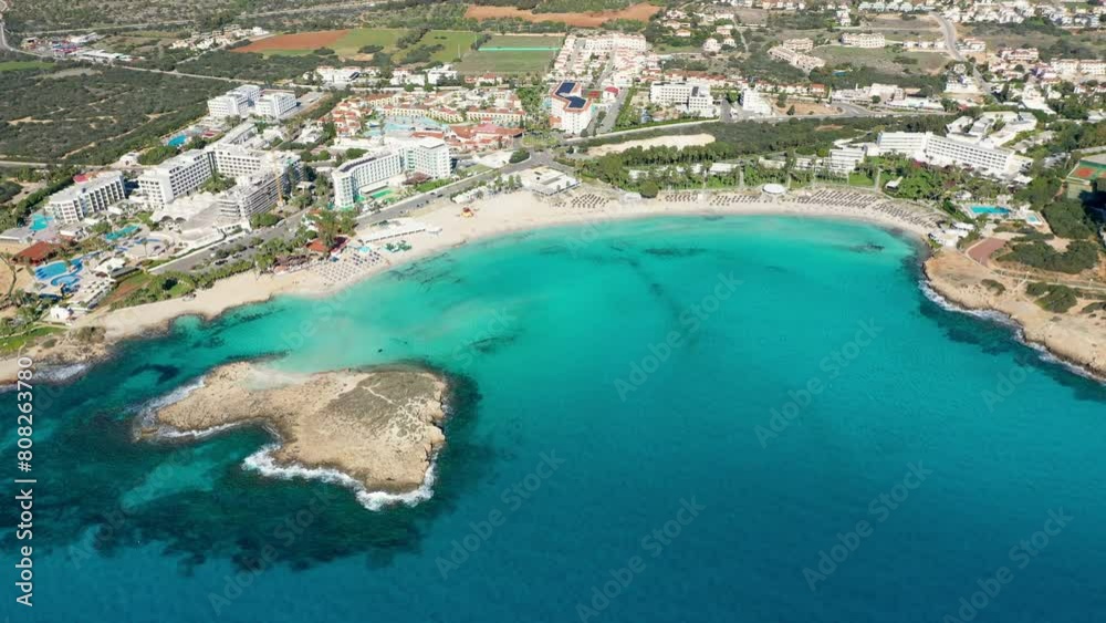 Aerial view of beautiful Nissi beach in Ayia Napa, Cyprus. Nissi beach in Ayia Napa famous tourist beach in Cyprus. A view of a azzure water and Nissi beach in Aiya Napa, Cyprus. Aerial view of beautiful Nissi beach in Ayia Napa, Cyprus. Nissi beach in Ayia Napa famous tourist beach in Cyprus. A view of a azzure water and Nissi beach in Aiya Napa, Cyprus.