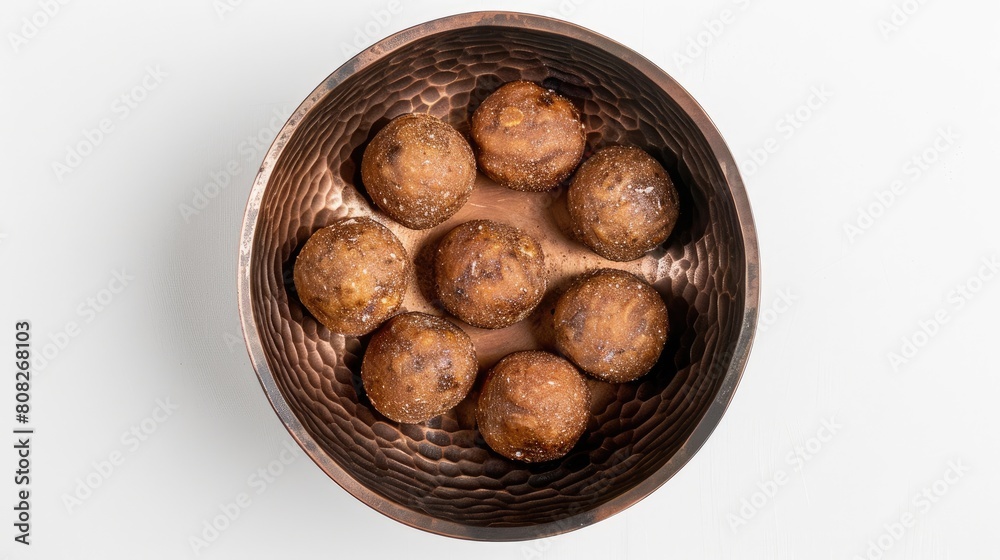 an ornate bronze bowl atop a white wooden table, against a Ramadan-themed backdrop, providing ample copy space for text to convey the essence of the holy month. an ornate bronze bowl atop a white wooden table, against a Ramadan-themed backdrop, providing ample copy space for text to convey the essence of the holy month.