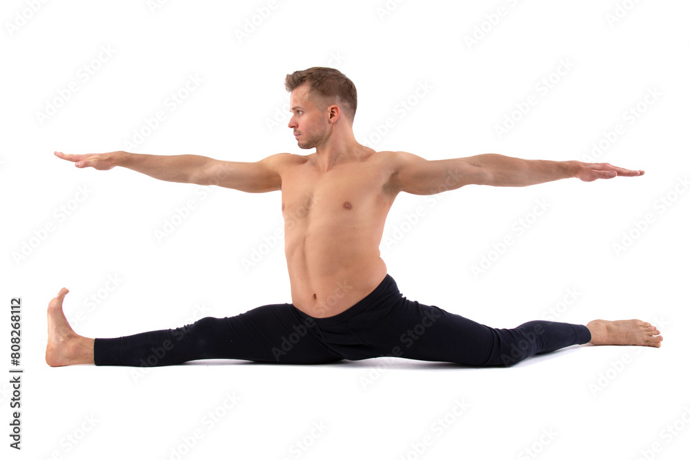 Fitness and meditation. Healthy lifestyle. Young attractive man doing yoga on a white background.