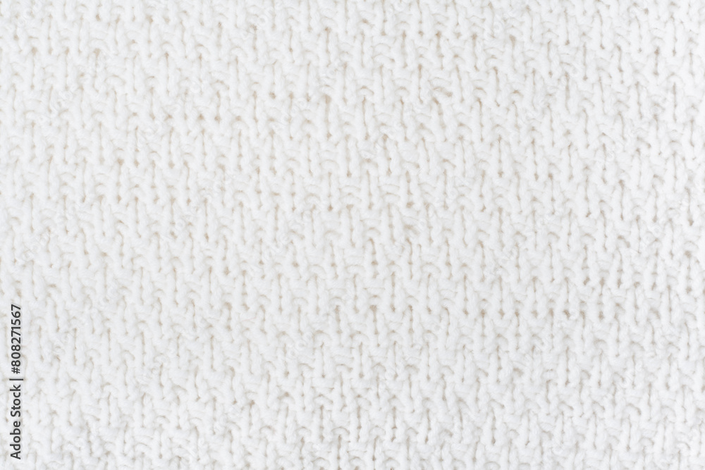 Sweater or scarf fabric texture large knitting. Knitted jersey background with a relief pattern. Wool hand- machine, handmade. Sweater or scarf fabric texture large knitting. Knitted jersey background with a relief pattern. Wool hand- machine, handmade.