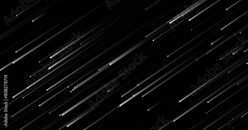 Speed falling of particles, diagonally moving from up to down. Abstract seamless looped kinetic animation of white color particles over black color background. photo