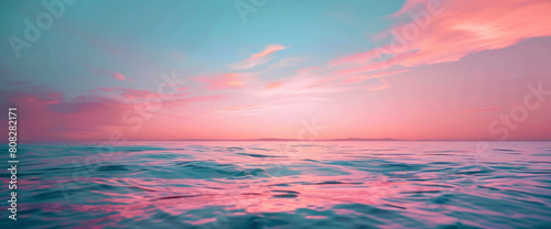 A symphony of coral pink and ocean blue blending softly  like a tranquil sunset painting the sky with gentle hues.