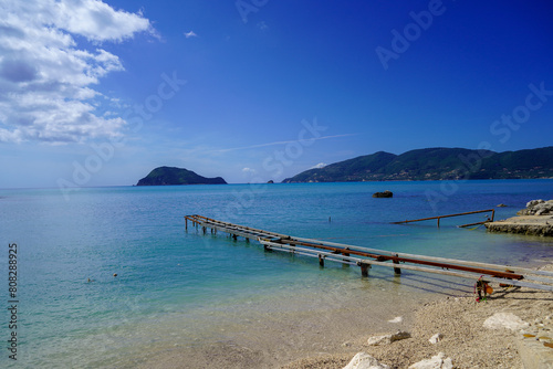 harbour of agios sostis and Cameo island photo