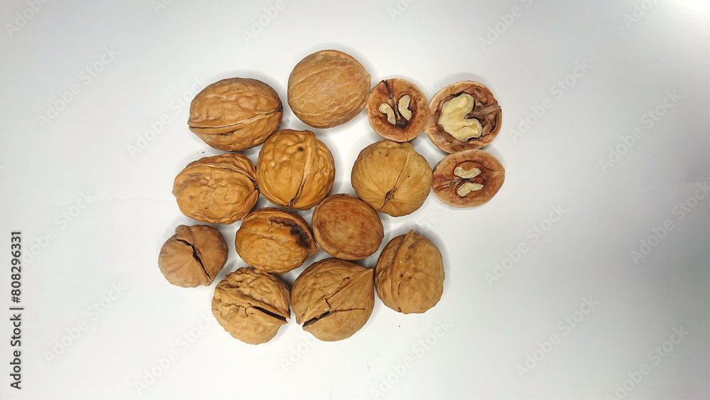 Walnut (Akhroot) with Artistic arrangement isolated on white background - health care concept Walnut (Akhroot) with Artistic arrangement isolated on white background - health care concept
