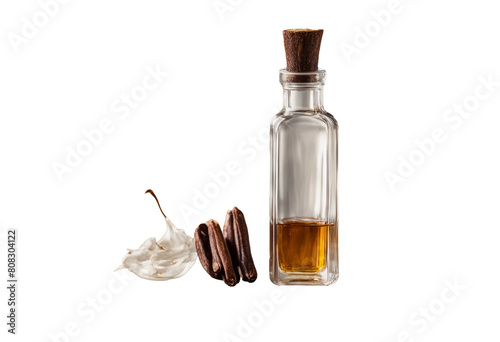A crystal vial of vanilla extract with a vanilla bean pod resting alongside isolated on transparent background