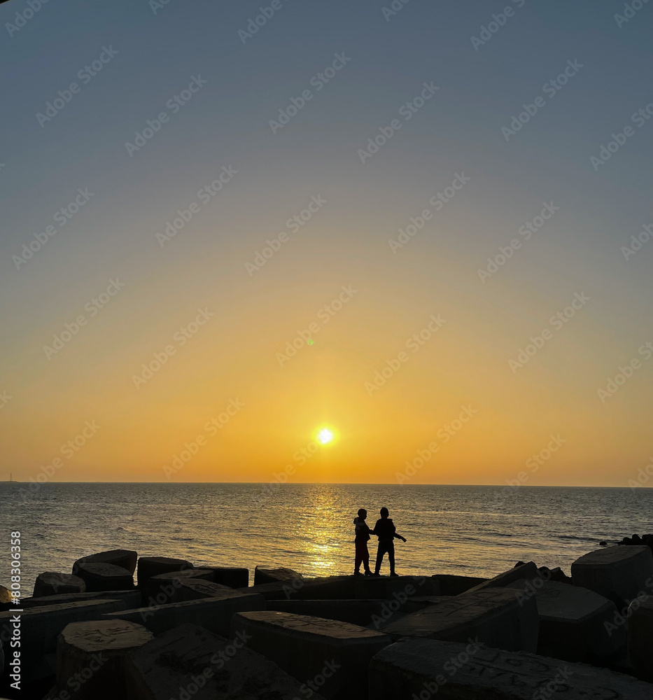 Fototapeta premium Two innocent kids playing and enjoying the sunset