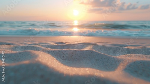  The sun is setting over the ocean; the sand is almost completely covered by the water, and the waves are foamy