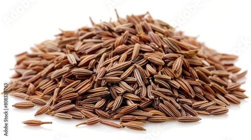 A pile of cumin seeds neatly centered, their rich brown color and small, oval shape vividly detailed against a white background