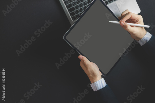 Businessman, a graphic designer using a stylus pen on the digital tablet screen, Man in casual ware online working photo