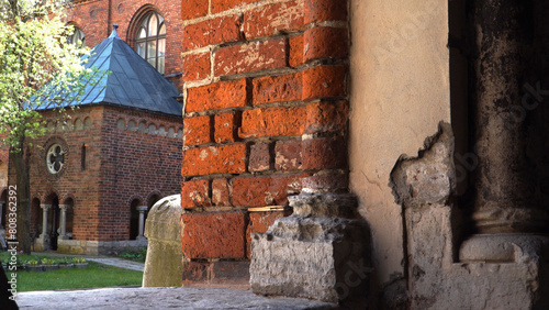 Close-up view of an ancient red brick wall support in the Riga Cathedral territory, Latvia - the charm of medieval history in the form of historic buildings.