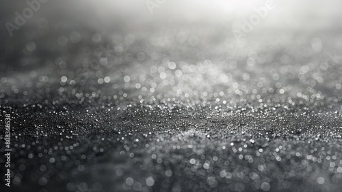 A blurry image of raindrops on a surface. The image is a close up of the raindrops, and the overall mood is one of calmness and serenity
