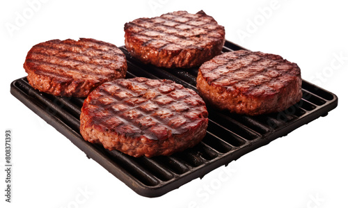 PNG Burger patties on the griller grilling cooking steak. photo