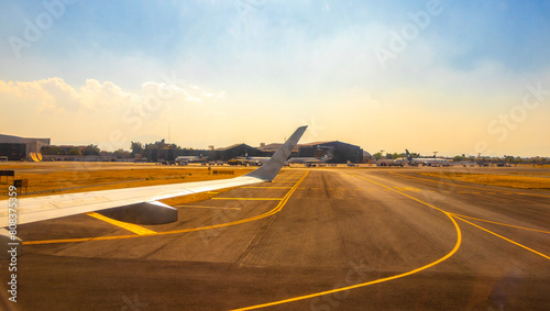 Aircraft at the airport Building and runway Mexico City Mexico.