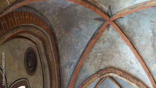 The arched ceiling formation in the medieval building of Riga Cathedral, the capital of Latvia. A fundamental example of historical construction. The monumental architecture decorative elements.