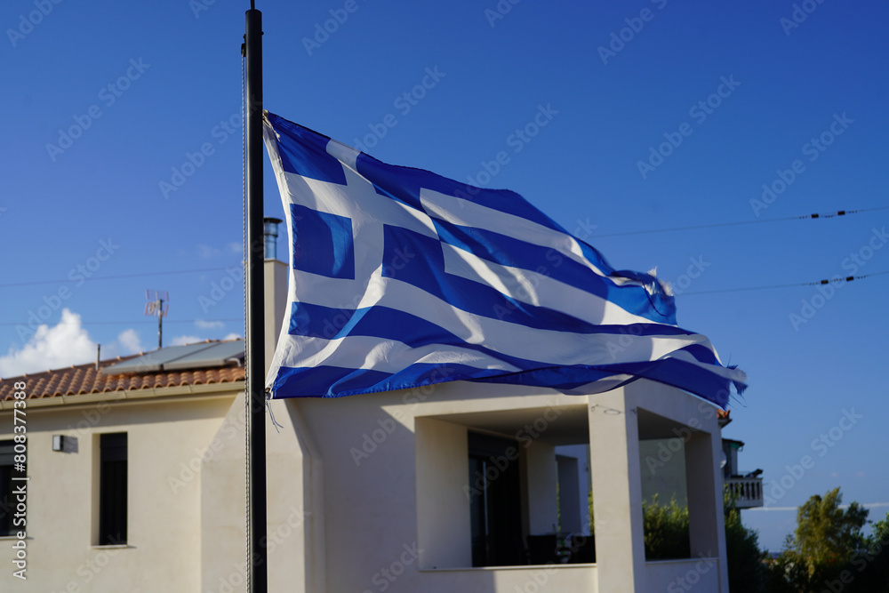 greek flag waving in the air