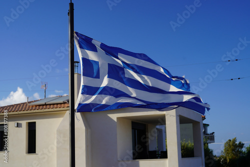 greek flag waving in the air