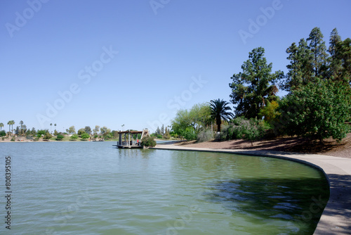 Picnic ramada and water side docking pier gazebo at lake Kiwanis park in Tempe, Arizona