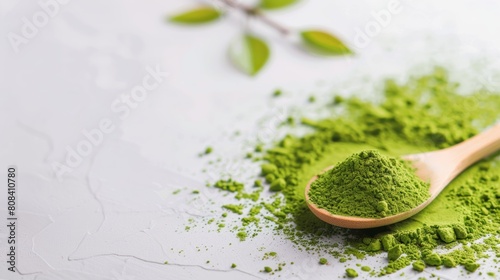 Green matcha powder on a white background