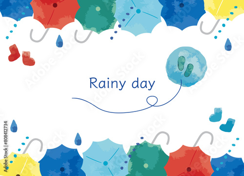 カラフルな傘と雨　6月のイメージ　水彩で描いたフレーム素材