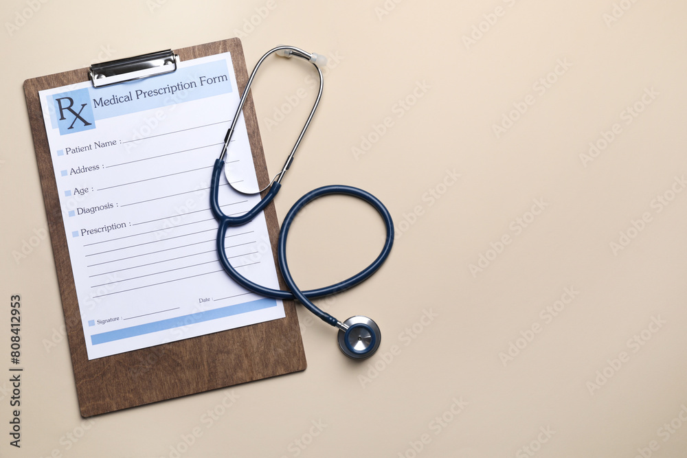 Clipboard with medical prescription form and stethoscope on beige background, flat lay. Space for text Clipboard with medical prescription form and stethoscope on beige background, flat lay. Space for text