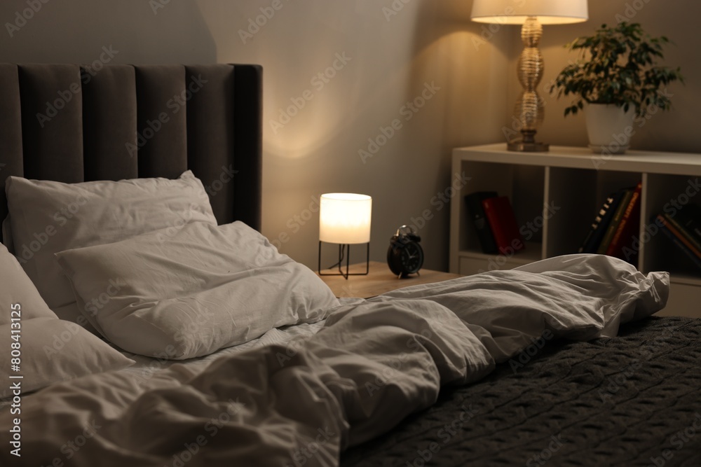 Φωτογραφία Soft bed, nightlight and cozy furniture indoors