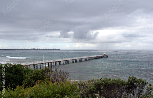 Wallpaper Mural Wooden pier jetty extending into an ocean underneath a cloudy stormy sky at Point Lonsdale in Victoria, Australia Torontodigital.ca