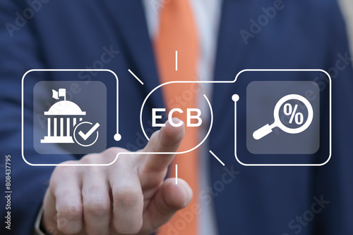 Business man working on virtual touch screen presses abbreviation: ECB. ECB European Central Bank business finance concept. ECB - prime component of Eurosystem and European System of Central Banks. photo