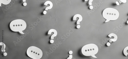 White speech bubbles with question marks on grey background, banner design for stock photo and web illustration.