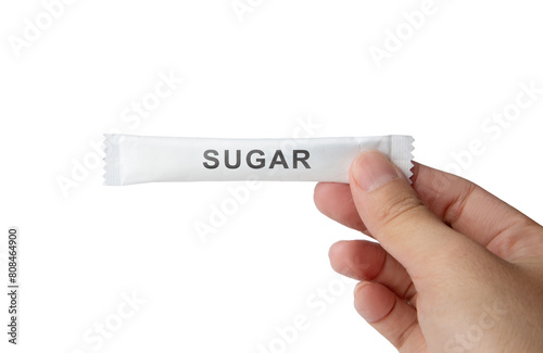 Hand holding sugar sachets isolated on white background