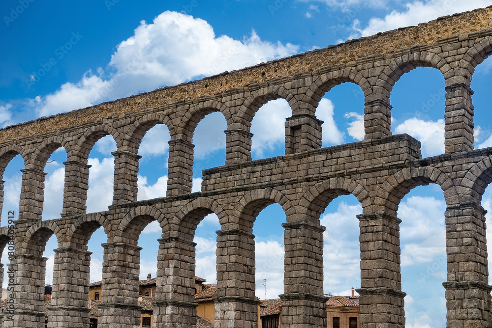 Segovia, España. April 28, 2022: The Segovia Aqueduct is a Roman aqueduct that carried water to the Spanish city of Segovia until 1973. Its construction dates from the beginning of the 2nd century AD. Segovia, España. April 28, 2022: The Segovia Aqueduct is a Roman aqueduct that carried water to the Spanish city of Segovia until 1973. Its construction dates from the beginning of the 2nd century AD.