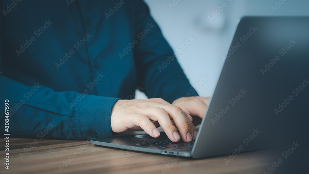 Entrepreneur use laptop working in home office. Man typing on laptop computer keyboard. Business and technology concept of entrepreneur work, work from home, businessman working at home office. Entrepreneur use laptop working in home office. Man typing on laptop computer keyboard. Business and technology concept of entrepreneur work, work from home, businessman working at home office.