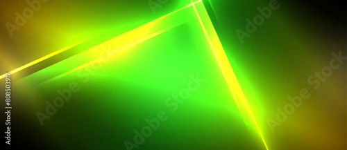 a green and yellow laser beam is shining on a black background . High quality