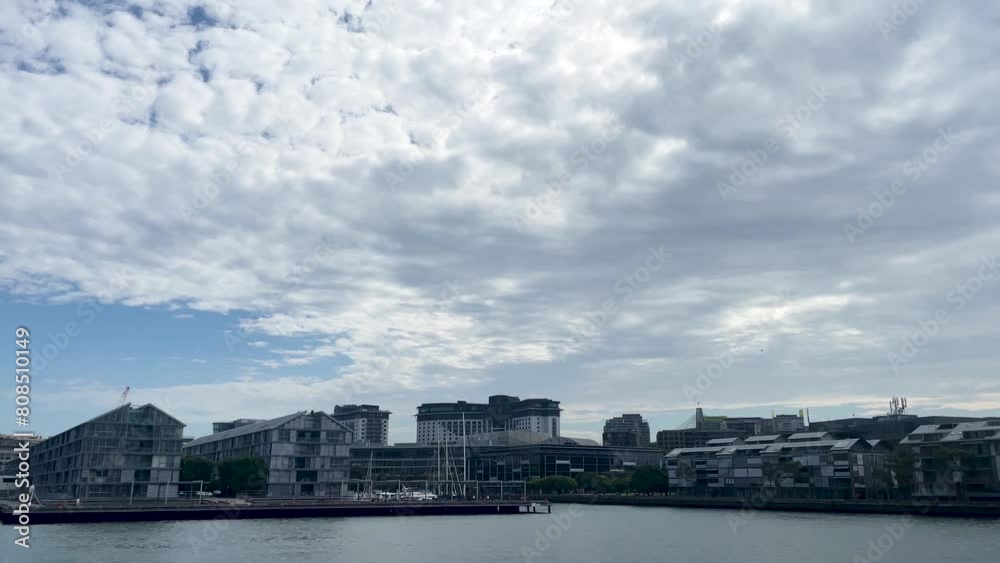 Passing Wharf Harbour with passing bird in Sydney Australia on cloudy day Passing Wharf Harbour with passing bird in Sydney Australia on cloudy day