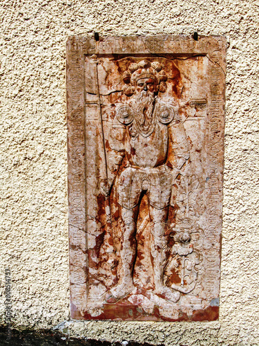 A well preserved bas-relief of a warrior in medieval armor on the outer wall of Konopiste Castle in the Czech Republic