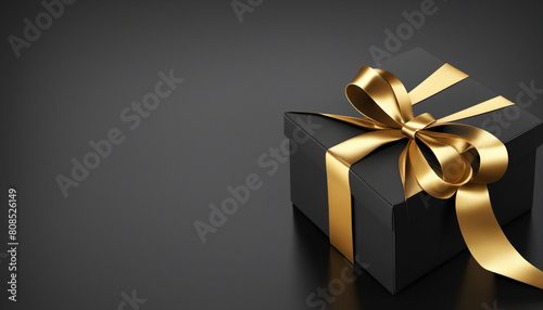 black gift box with gold ribbon