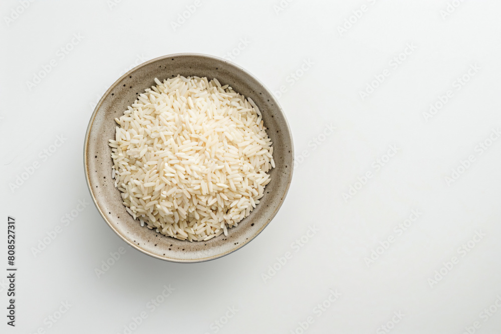 a bowl of rice on a white surface a bowl of rice on a white surface