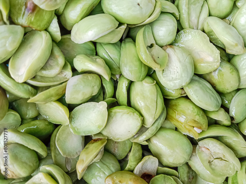 Petai, the bitter bean, twisted cluster bean or stink bean (Parkia speciosa). Bitter bean texture background.