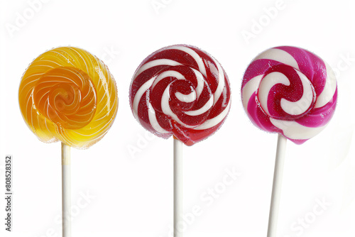 three lollipops are shown on a stick