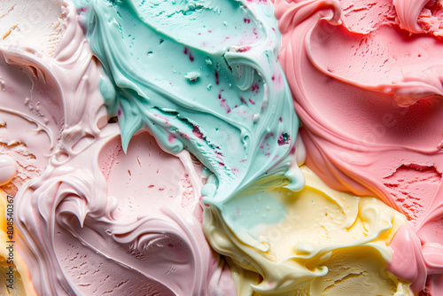 A colorful swirl of ice cream with pink, blue, and yellow swirls. The colors are bright and cheerful, creating a fun and playful mood