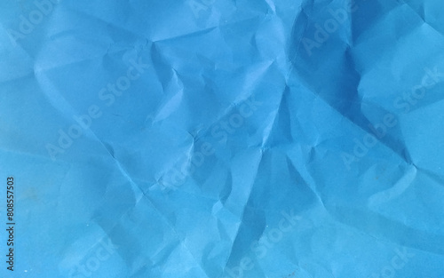 Blue crumpled paper background. Vector texture of crumpled paper. Background paper. Textured wallpaper. Crumpled paper design