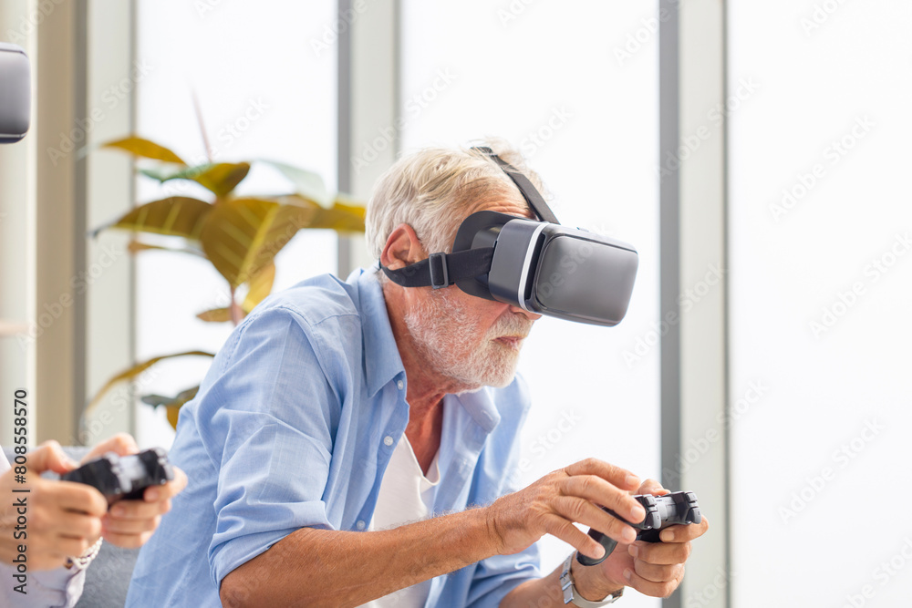 Senior caucasian man playing video game using virtual reality glasses and joystick Senior caucasian man playing video game using virtual reality glasses and joystick
