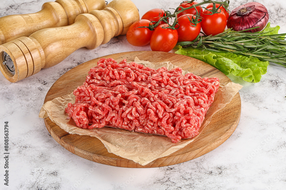 Raw minced beef meat on cutting board Raw minced beef meat on cutting board