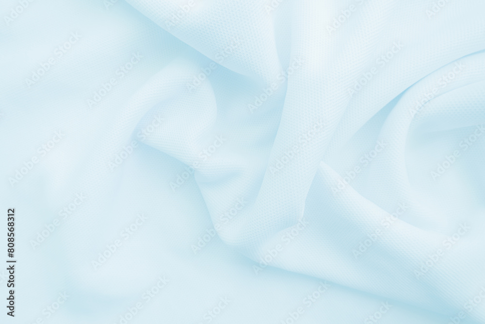 Fototapeta premium Wavy Cloth. light blue fabric background
