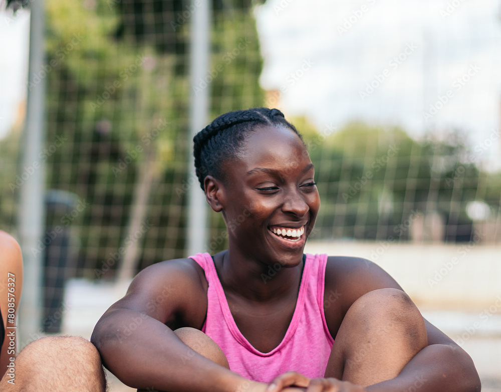 Athlete woman laughing relaxed after a match
