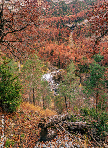 The magic of the autumn landscape of Monte Perdido, the Arripa Waterfall is located in the Arazas River Valley, in the Ordesa y Monte Perdido National Park. photo