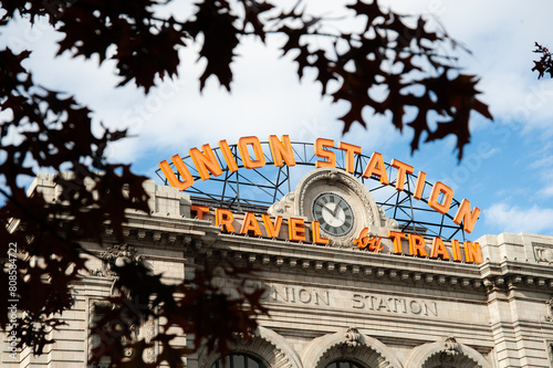 Historic Denver Union Station sign through autumn leaves photo