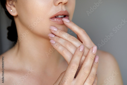 Beauty Woman face Portrait. Beautiful Spa model Girl with Perfect Fresh Clean. Nail Care And Manicure.