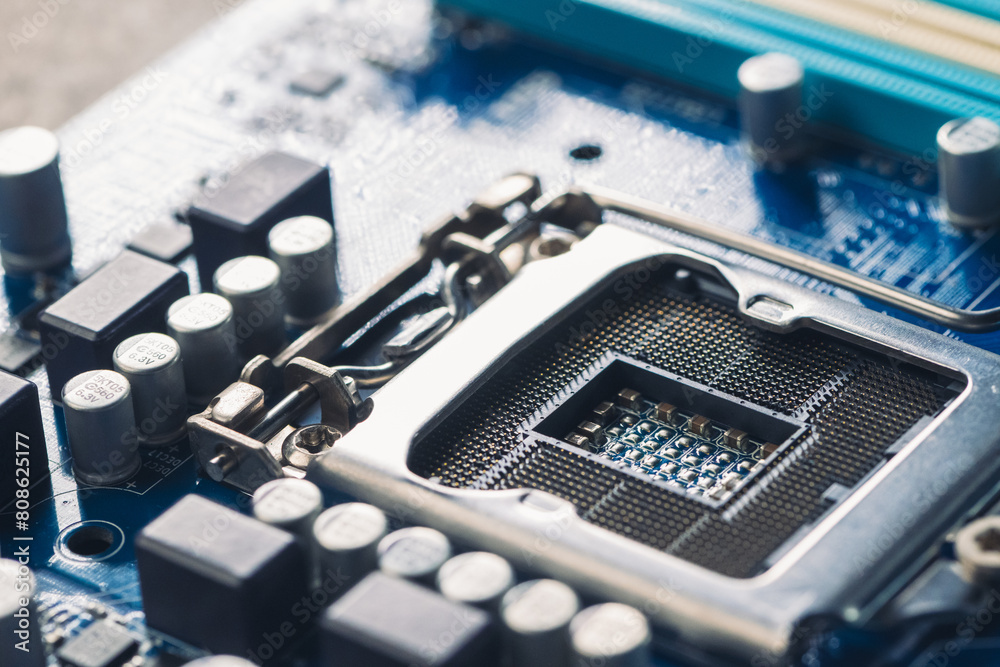 The technician is putting the CPU on the socket of the computer motherboard. The technician is putting the CPU on the socket of the computer motherboard.